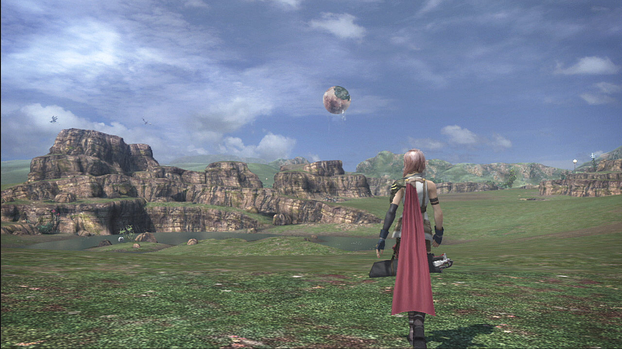 FFXIII screenshot of Lightning standing on a large open grassy field with the world of Cocoon floating in the sky.