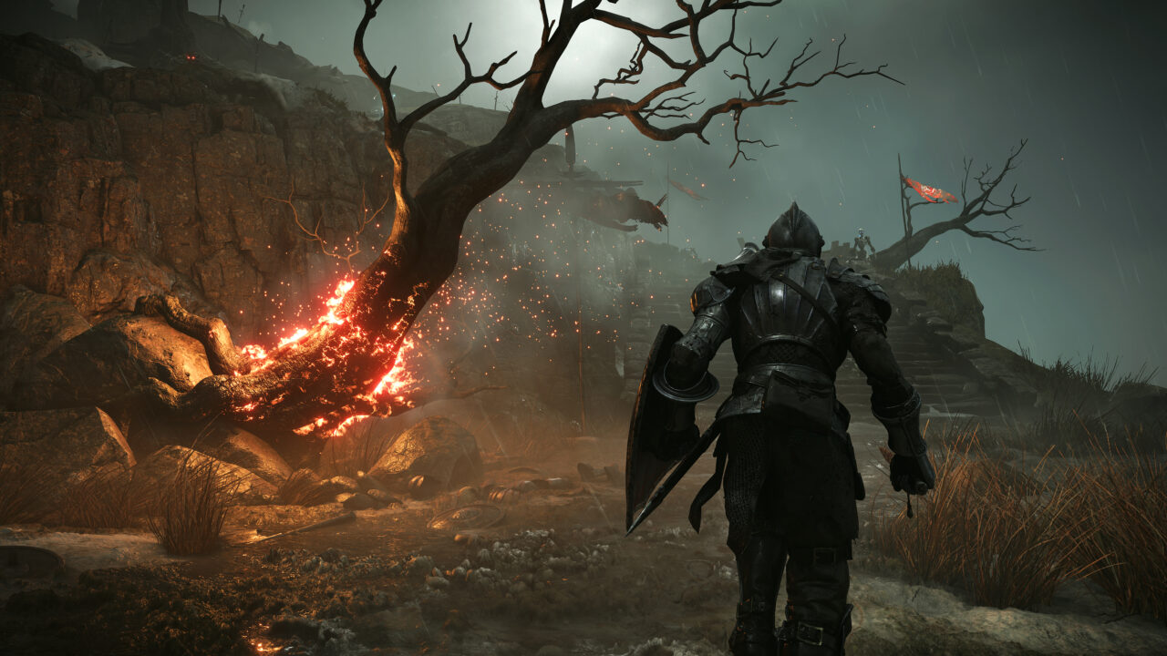 Knight walking in the rain past a dead tree erupting in flames