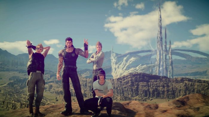 The Boys of Final Fantasy XV enjoying a group selfie over a scenic background.