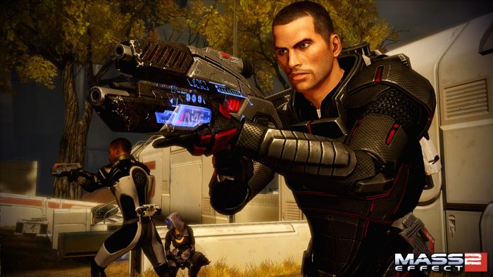 Shepard aims a glowing blue gun.