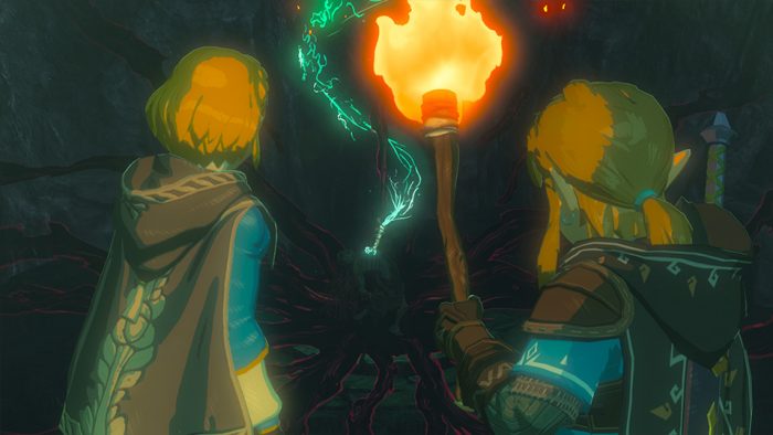 Link and Zelda staring off into a dark cave