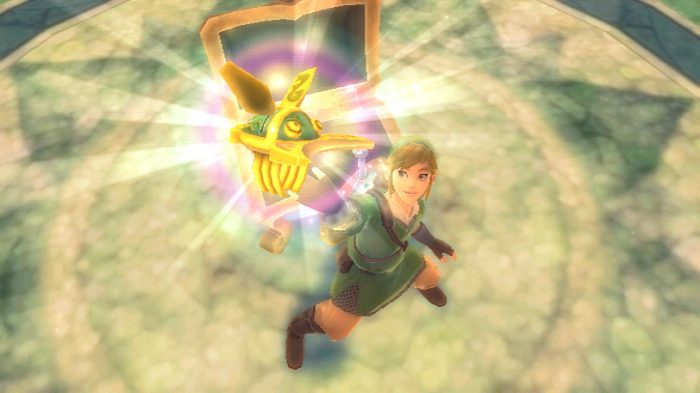 Link holds up a golden remote-controller beetle in The Legend of Zelda: Skyward Sword Screenshot