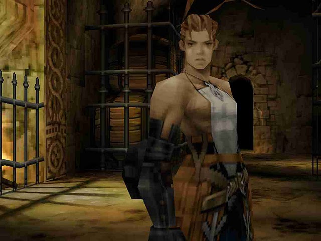 Vagrant Story screenshot of Ashley in a dim stone room with wrought iron fencing, wooden barrels, and firelight behind him.
