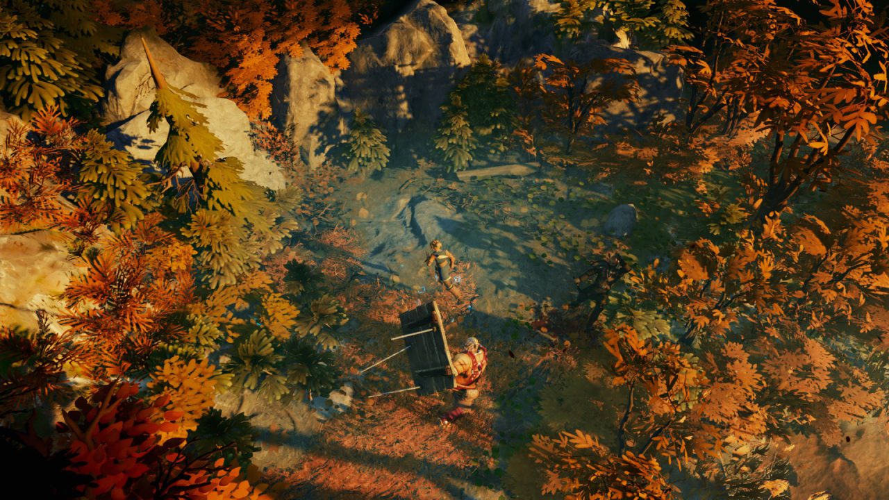 Iron Danger screenshot of Kipuna and Topi exploring some old stone ruins in a forest of reddish leaves.