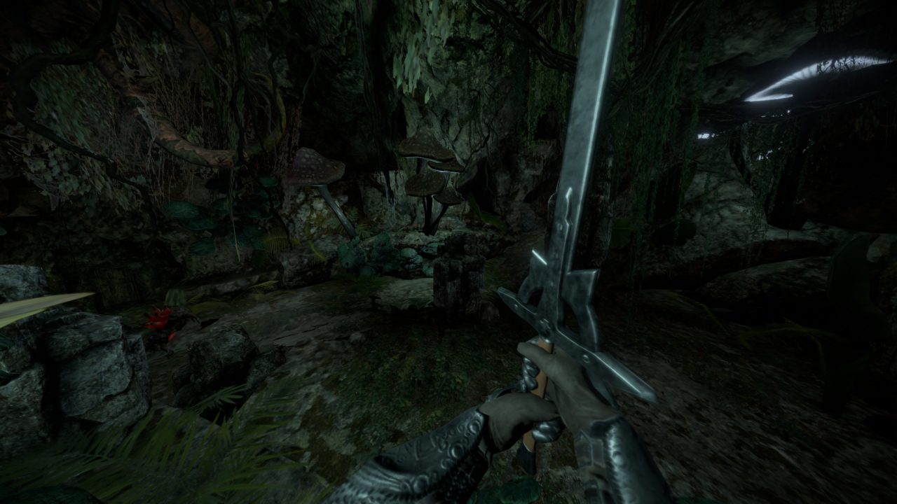 The player wields a mighty sword in a dank cavern in Isles of Adalar.
