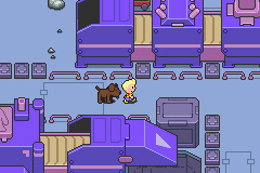 Just Lucas and his dog walking along in an industrial-looking area in this Mother 3 screenshot.