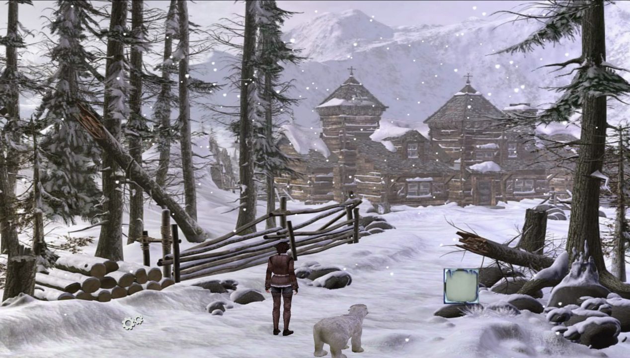 Syberia screenshot of a woman in a snow-covered landscape with a rustic lodge in the near distance.