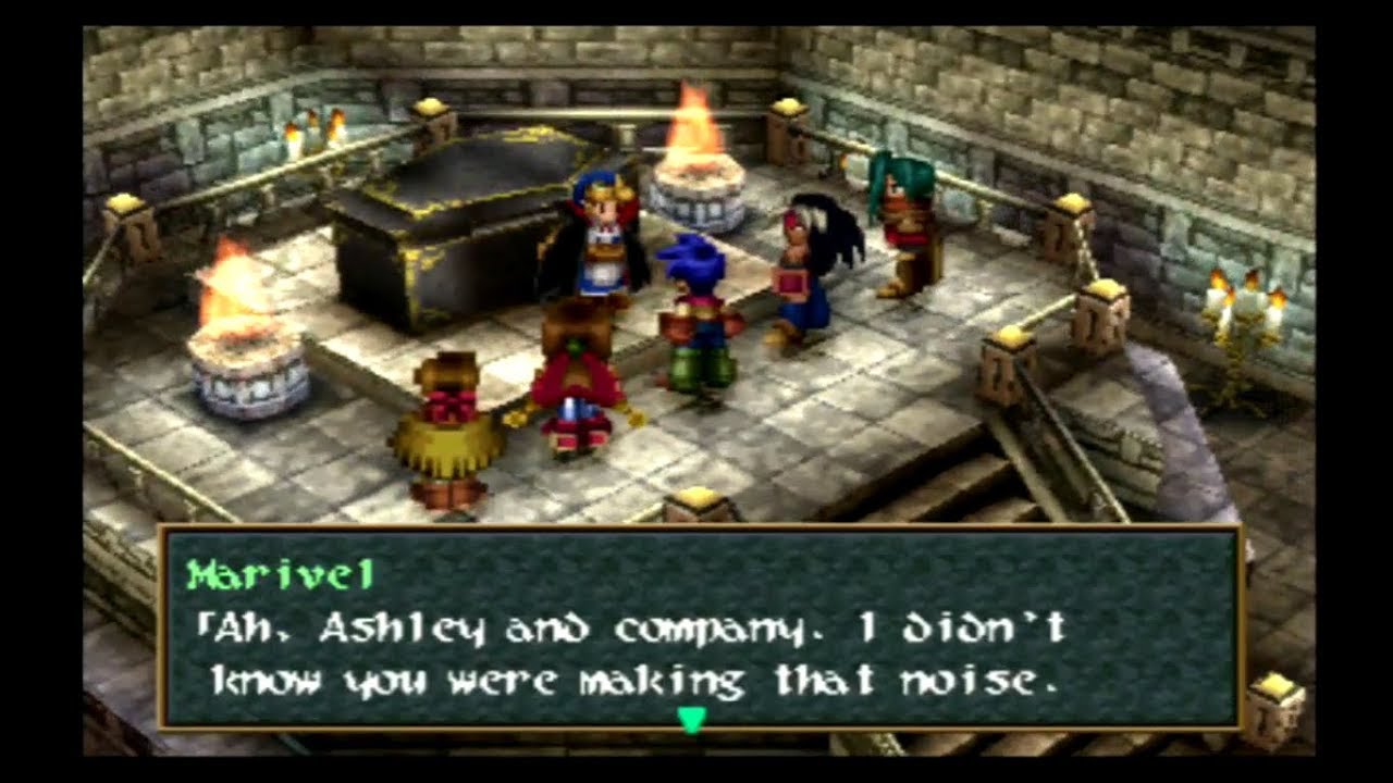 The party stands in front of a vampire and a coffin.