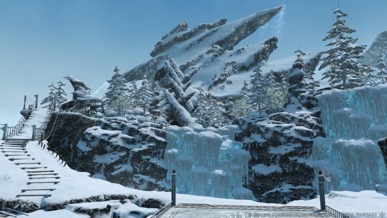 Final Fantasy XIV Endwalker screenshot of a frozen mountain, with a snowy bridge visible to the far left.