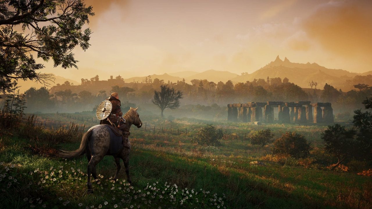 Eivor on horseback gazes upon a stone circle in Assassin's Creed Valhalla's Wrath of the Druids DLC.