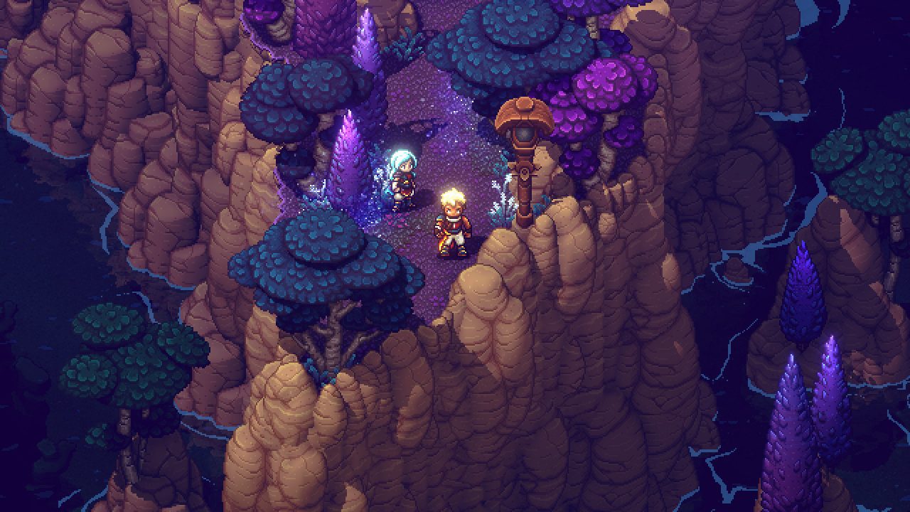 Sea of Stars screenshot of two characters in a colorful forest at the edge of a cliff.
