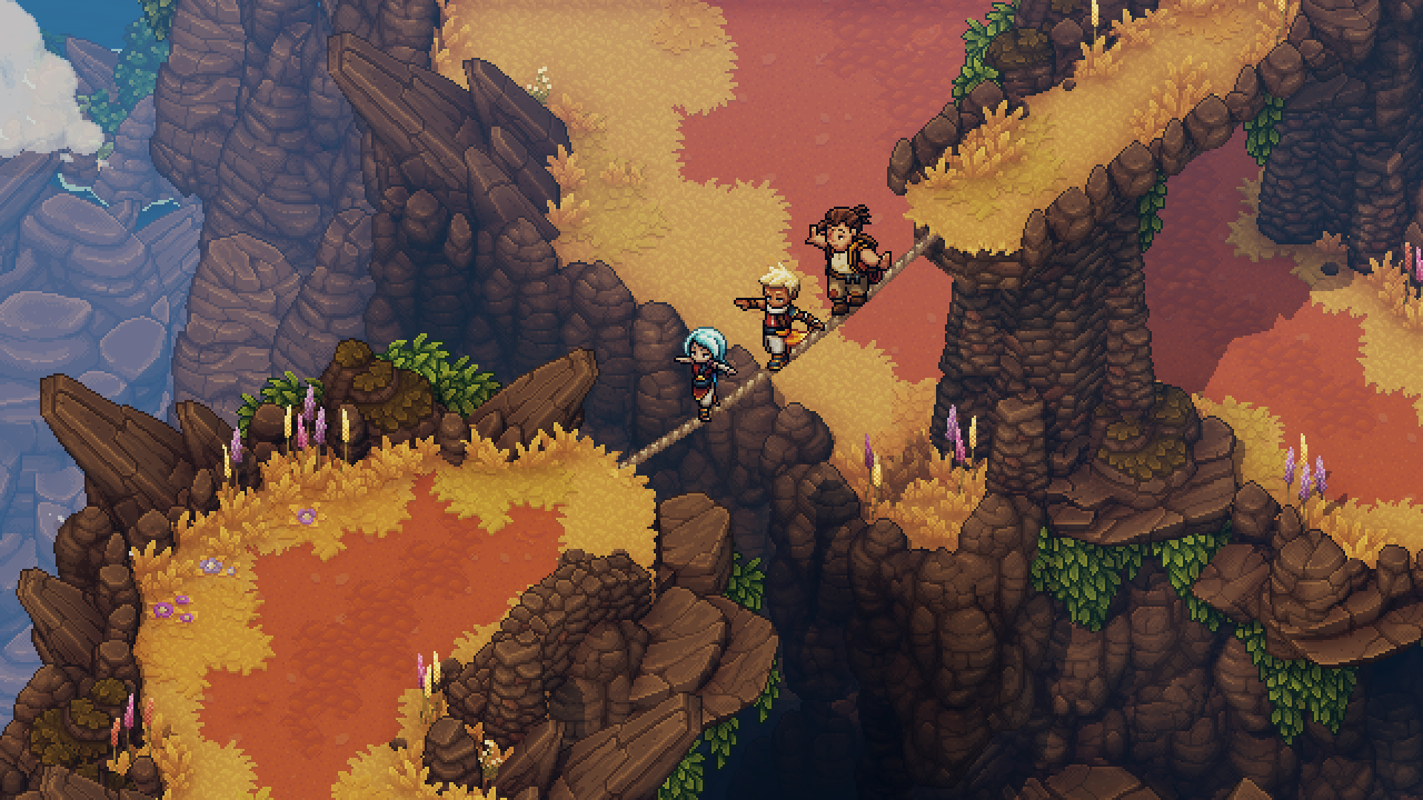 Sea of Stars screenshot of Valere, Zale, and Garl carefully crossing a tightrope stretched between two cliffs in a mountainous area filled with yellow grass.