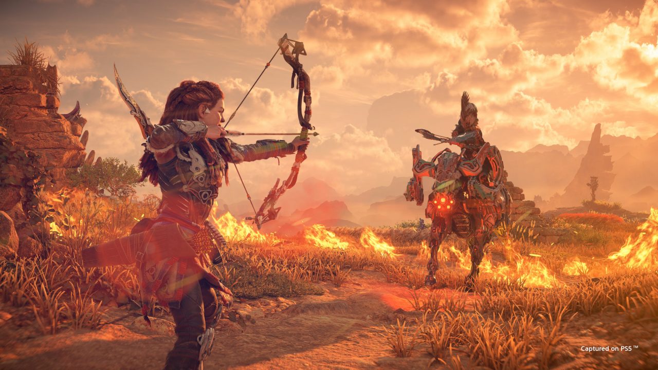 Aloy prepares to fire an arrow at a mechanical monster in Horizon Forbidden West