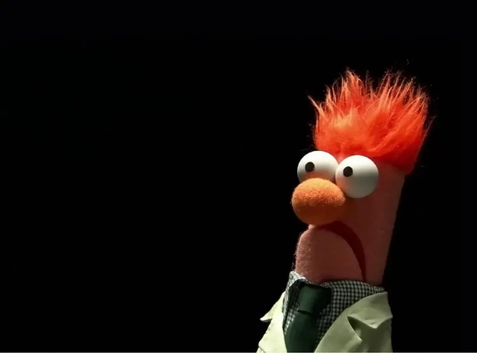 A screen from The Muppets featuring Beaker