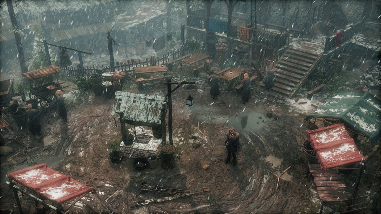 A desolate, unpaved town square with several ramshackle structures like a well, wagons, and benches. It appears to be raining or hailing.