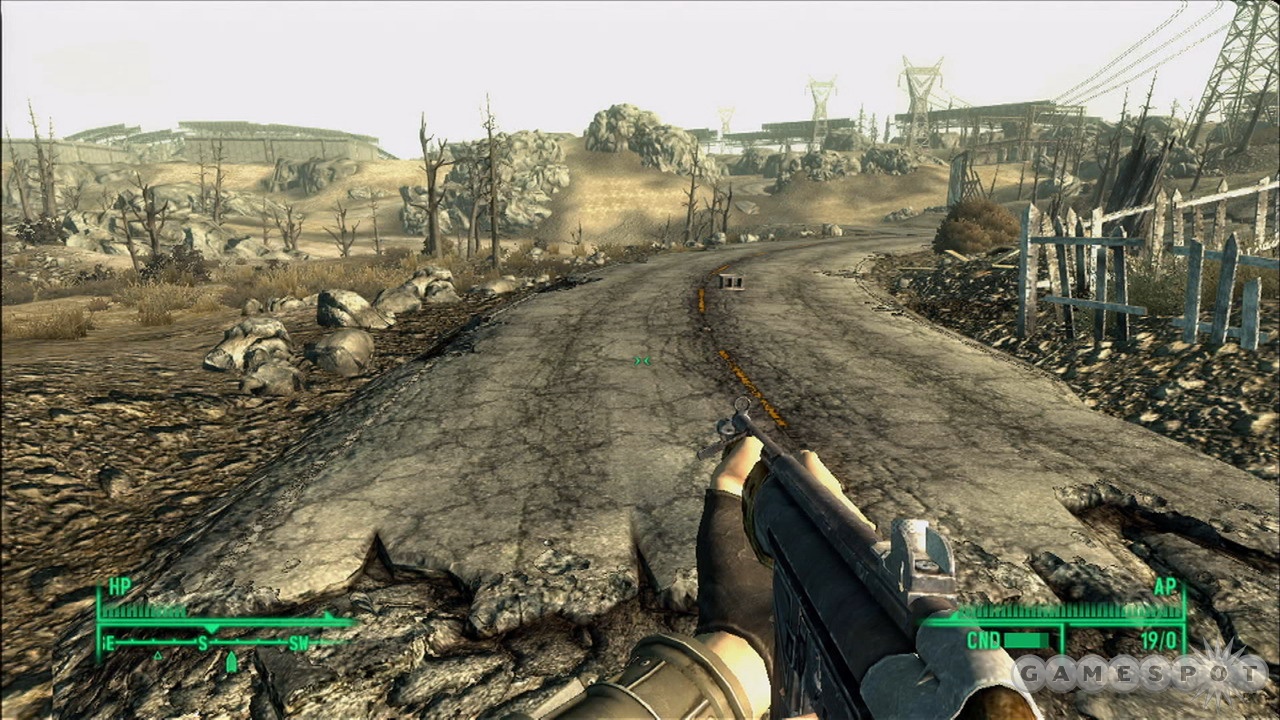 Gracz przygotowuje swoją broń przed opuszczonym krajobrazem.