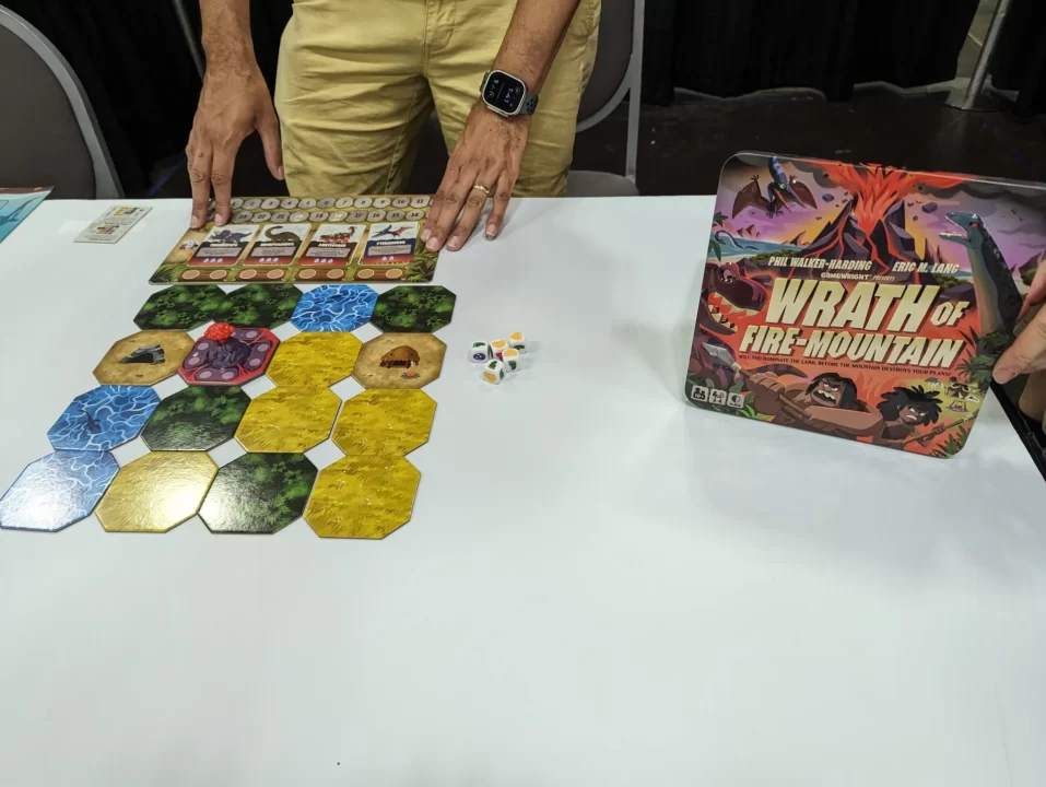 Wrath of Fire-Mountain box and game setup on a table at Origins Game Fair 2024.