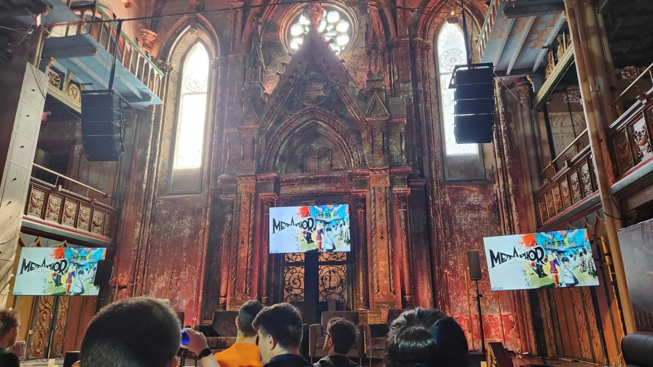 Metaphor ReFantazio Event Photo of screens with the game in a gothic cathedral