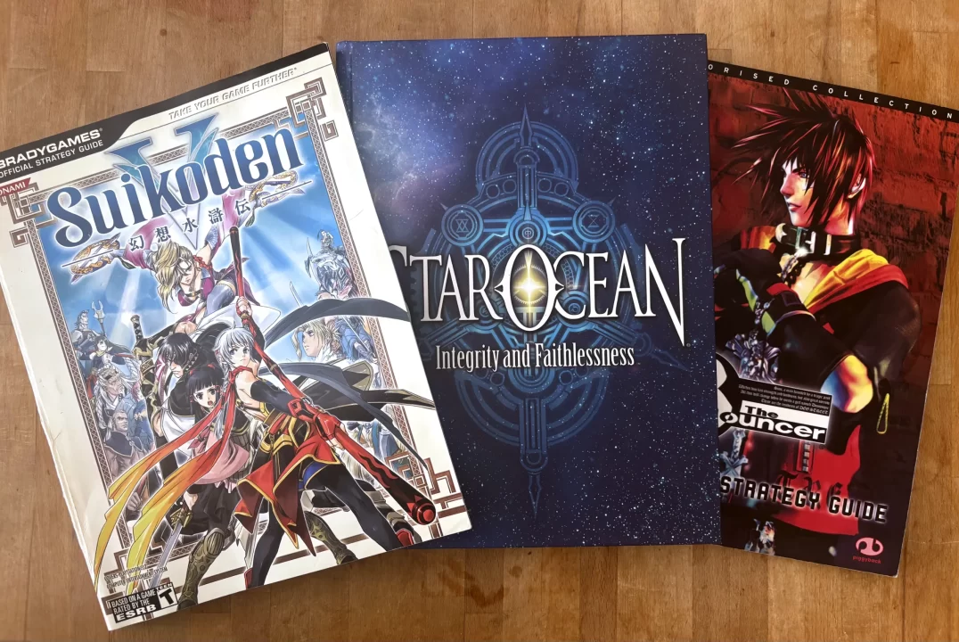 Suikoden V, Star Ocean 5, and The Bouncer Strategy Guides on a wood backdrop