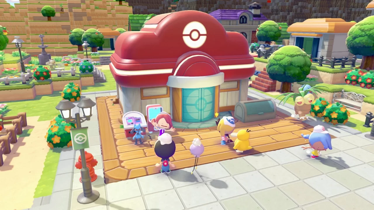 Ditto and friends outside a Pokémon Center in Pokémon Pokopia, other Dittos run around to demonstrate multiplayer mode!