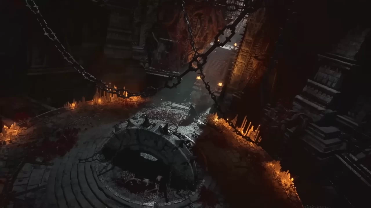 Lords of the Fallen II Screenshot of a player who enters a dark dungeon arena filled with blood and hanging chains