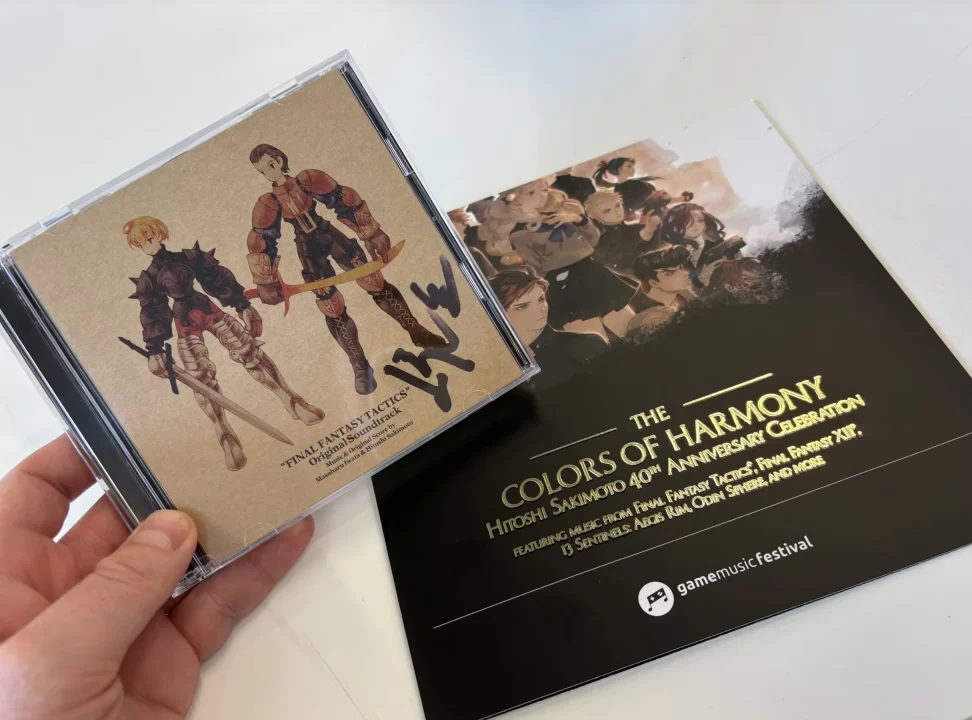 Image featuring a Colors of Harmony program and signed FF Tactics OST CD.