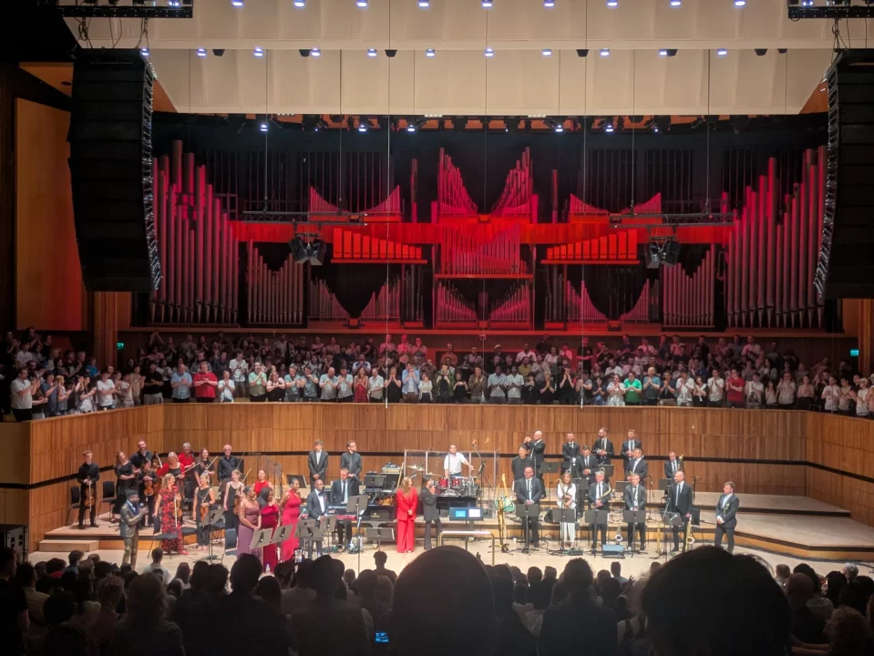 Musical ensemble members of the Persona Grooves concert on stage at the Royal Festival Hall.