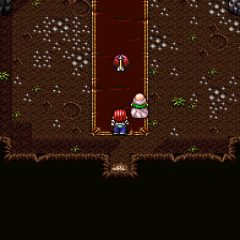 Maxim and an old man in a cave, launching an arrow at a Red Jelly in Lufia I & II: The Sinistrals Saga